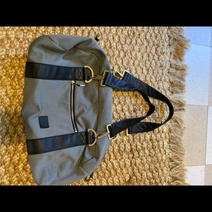 nike beautility gym bag, gray with gold hardware.